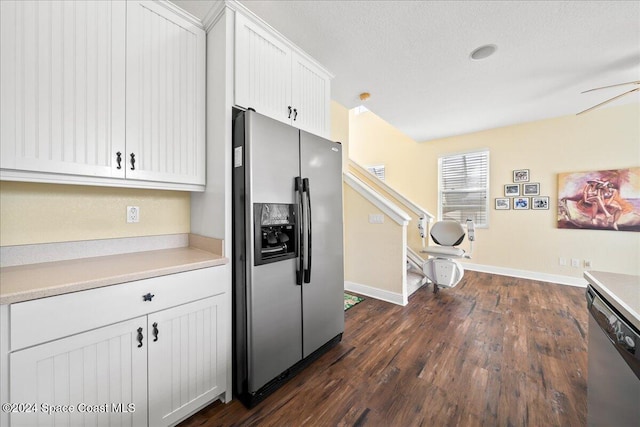 kitchen with white cabinets, stainless steel appliances, ceiling fan, and dark wood-type flooring