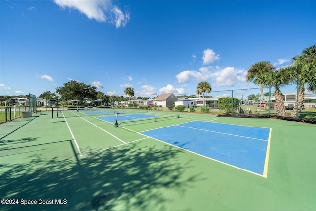 view of sport court with basketball hoop