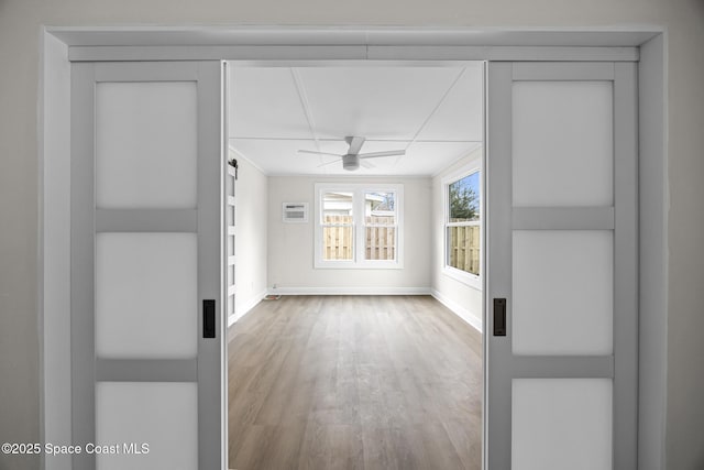 spare room with hardwood / wood-style flooring and ceiling fan