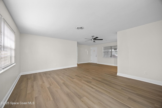 unfurnished living room with ceiling fan and light hardwood / wood-style floors