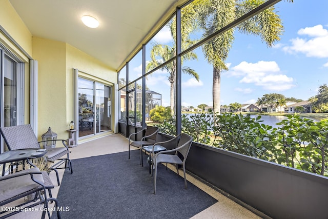 sunroom with a water view