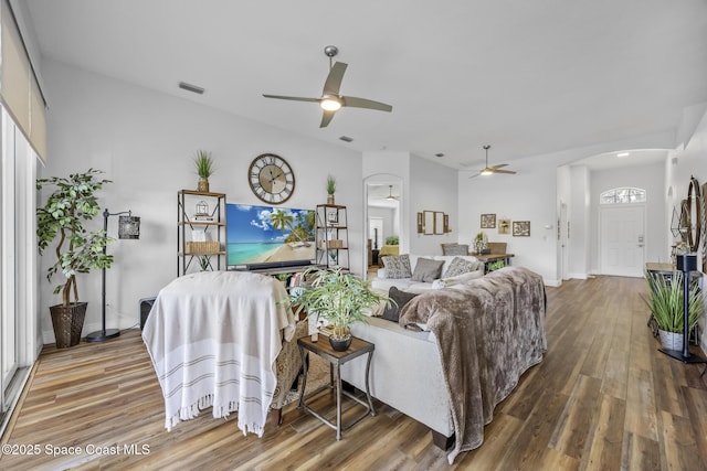 living room featuring hardwood / wood-style flooring and ceiling fan