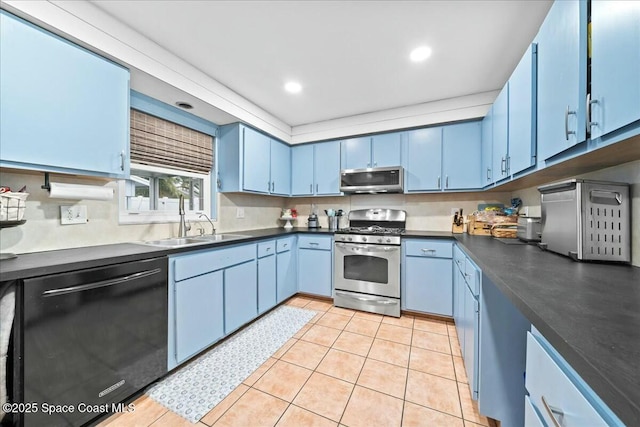 kitchen with light tile patterned floors, stainless steel appliances, blue cabinets, and sink