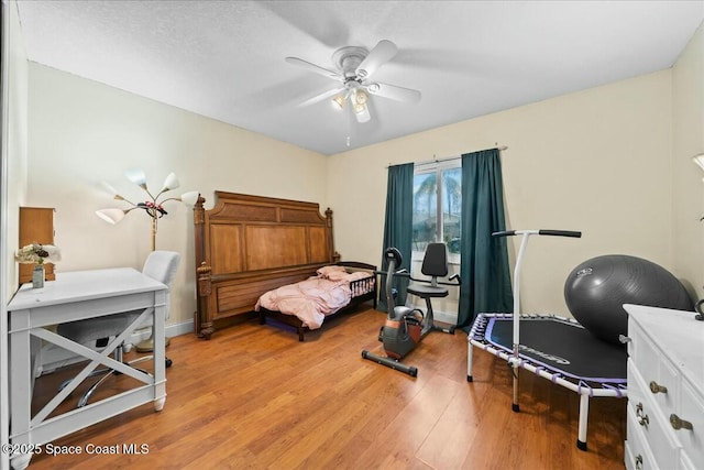 bedroom featuring light wood-type flooring and ceiling fan