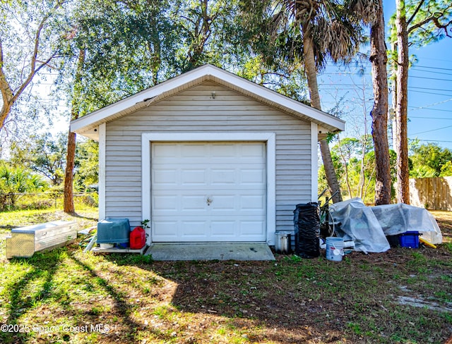 garage featuring fence