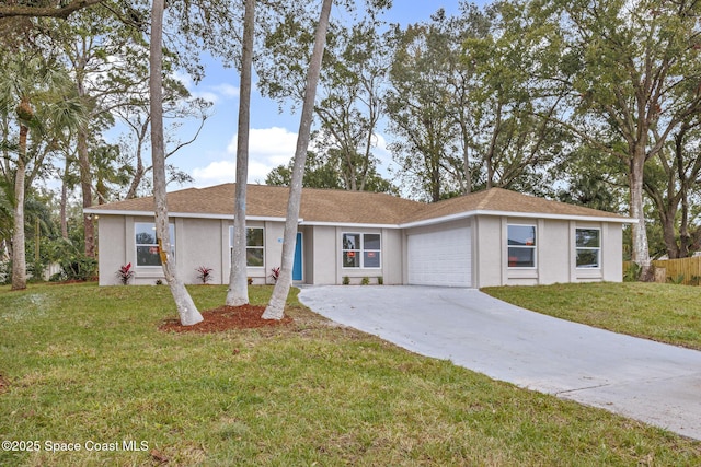 ranch-style home with a front yard and a garage