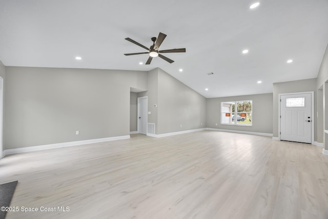 unfurnished living room featuring ceiling fan, light wood-type flooring, and lofted ceiling