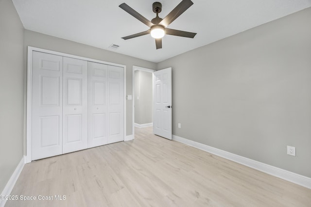 unfurnished bedroom featuring a closet, ceiling fan, and light hardwood / wood-style floors