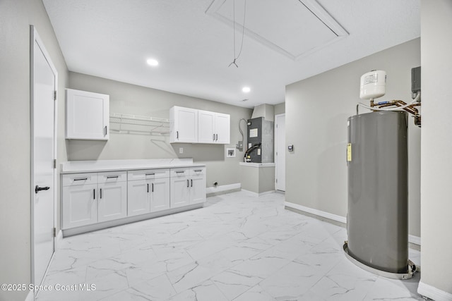 clothes washing area featuring electric dryer hookup, cabinets, washer hookup, water heater, and heating unit