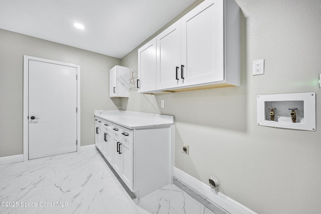 laundry area with hookup for a washing machine, cabinets, and hookup for an electric dryer