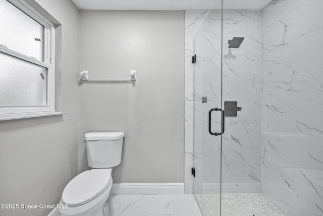 bathroom with toilet, walk in shower, and a healthy amount of sunlight