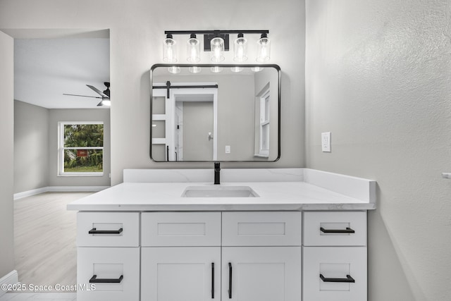 bathroom featuring ceiling fan and vanity