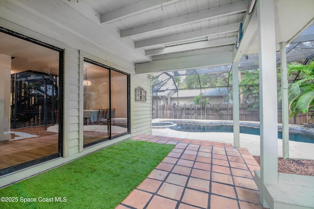 unfurnished sunroom with beam ceiling