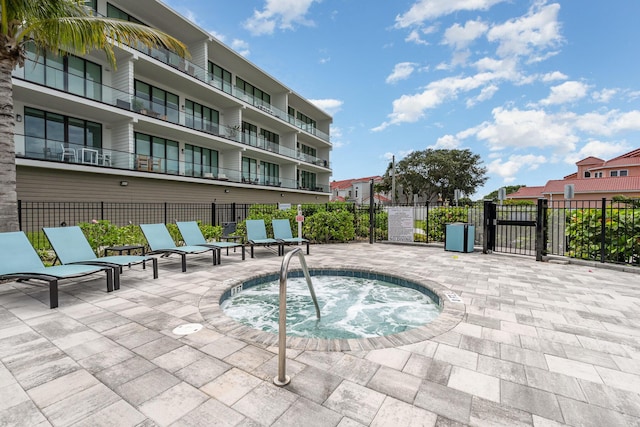 view of pool with a community hot tub