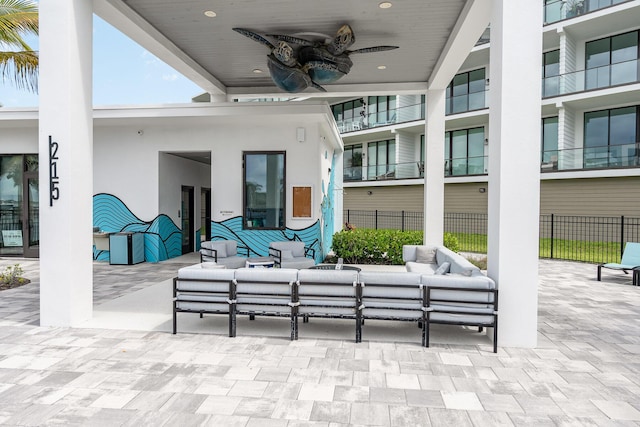 view of patio with ceiling fan and an outdoor hangout area