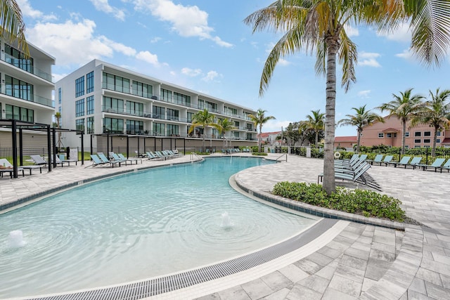 view of pool with pool water feature and a patio area