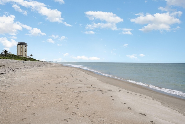 view of water feature with a beach view