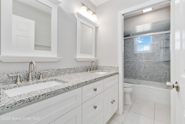 full bathroom featuring vanity, toilet, tile patterned flooring, and combined bath / shower with glass door