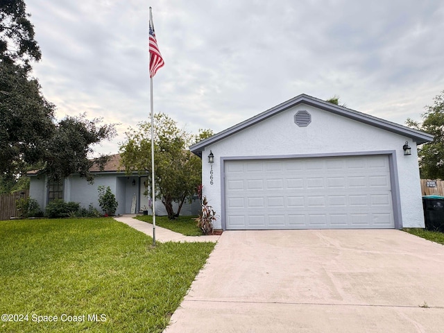 ranch-style house with a front yard and a garage