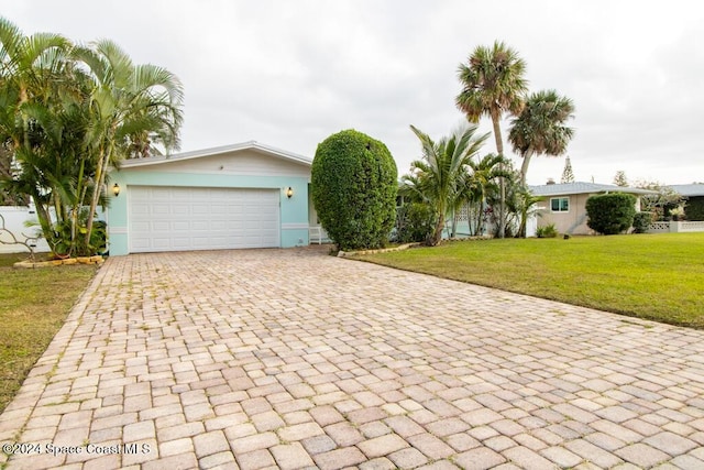 ranch-style house with a front lawn and a garage