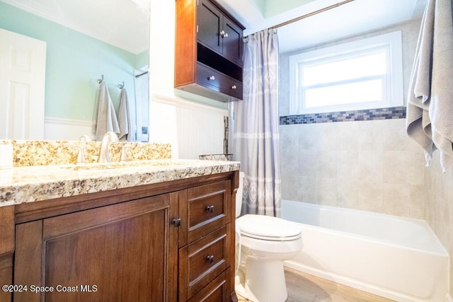 full bathroom with vanity, shower / bath combination with curtain, and toilet