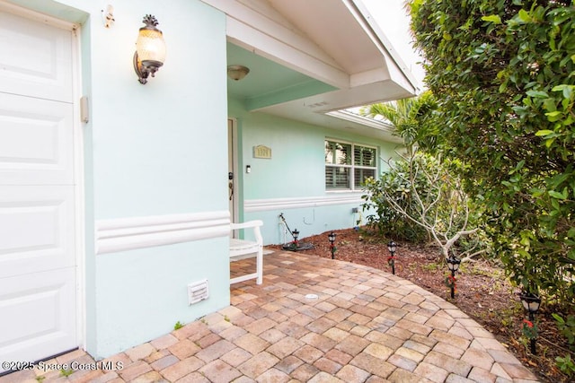 doorway to property featuring a patio