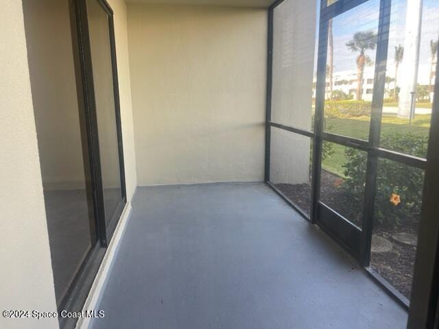 unfurnished sunroom featuring plenty of natural light