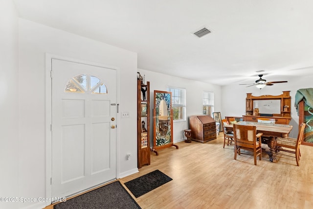 foyer featuring ceiling fan and light hardwood / wood-style flooring