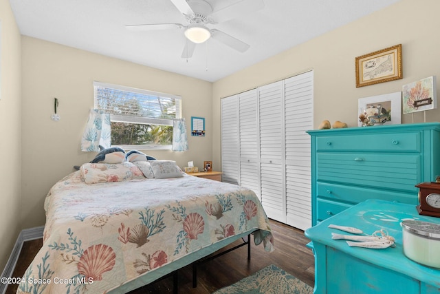 bedroom featuring ceiling fan, a closet, and dark hardwood / wood-style floors