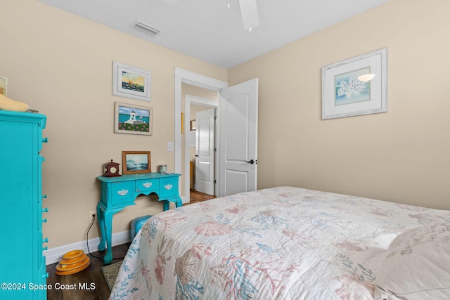 bedroom with ceiling fan and wood-type flooring