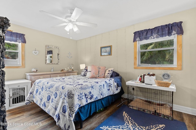 bedroom featuring ceiling fan and dark wood-type flooring