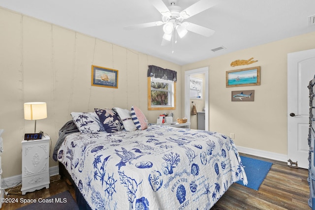 bedroom featuring ceiling fan and dark wood-type flooring