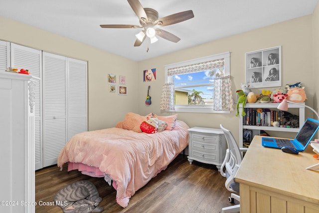 bedroom with dark hardwood / wood-style flooring, a closet, and ceiling fan