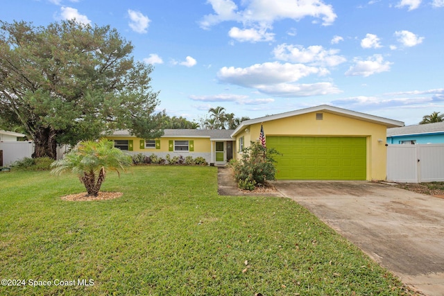 single story home with a front yard and a garage