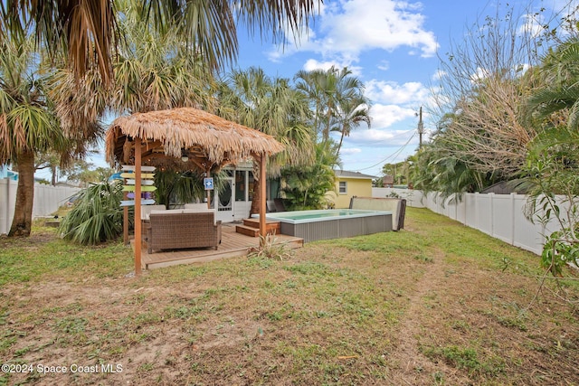 view of yard featuring an outdoor living space and a wooden deck