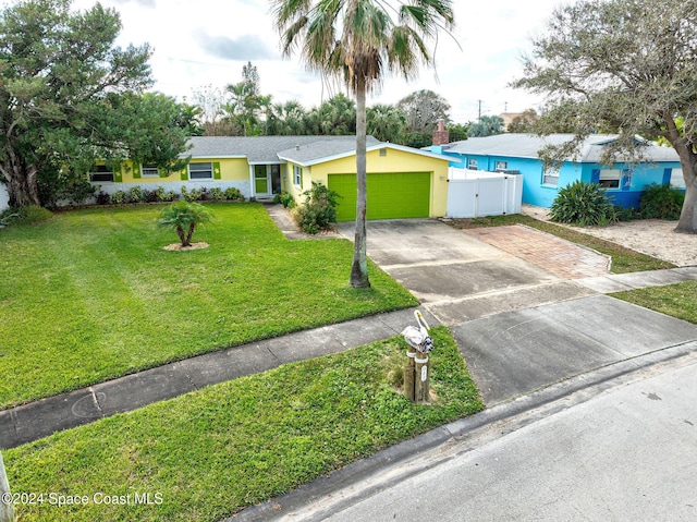 single story home with a garage and a front lawn