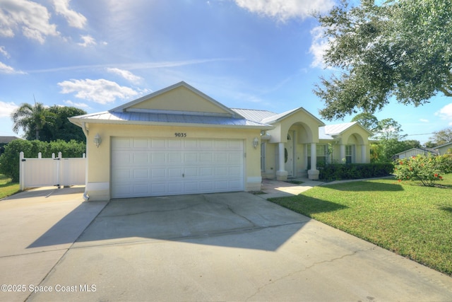 view of front facade with a garage and a front lawn