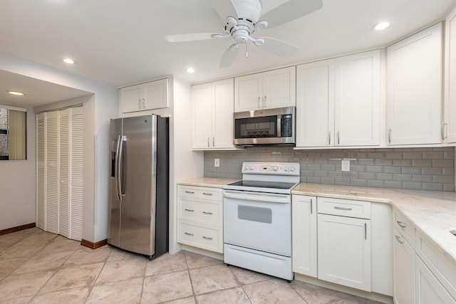 kitchen featuring decorative backsplash, appliances with stainless steel finishes, light stone counters, ceiling fan, and white cabinetry