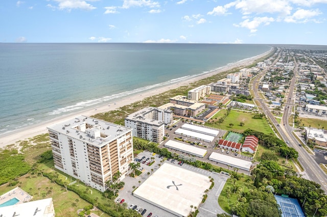 birds eye view of property with a view of the beach and a water view