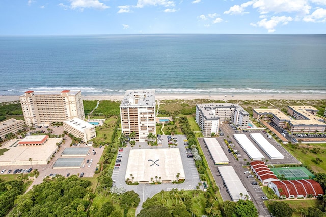 birds eye view of property featuring a water view and a view of the beach