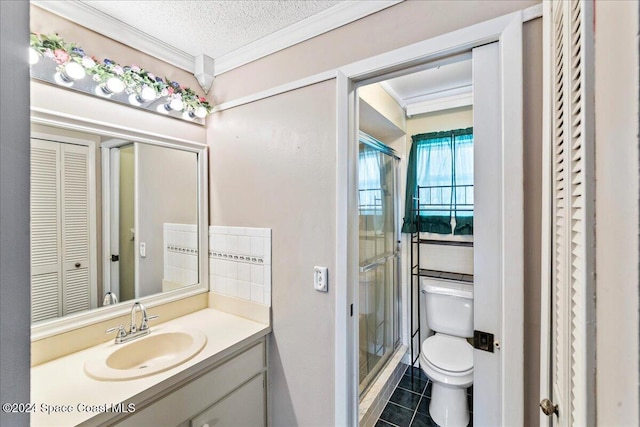 bathroom with ornamental molding, vanity, a textured ceiling, tile patterned flooring, and toilet