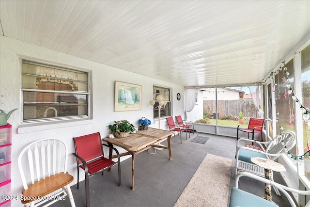 sunroom / solarium featuring wooden ceiling