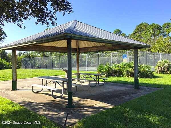 view of property's community with a gazebo and a yard