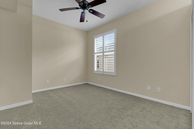 unfurnished room featuring ceiling fan and light colored carpet