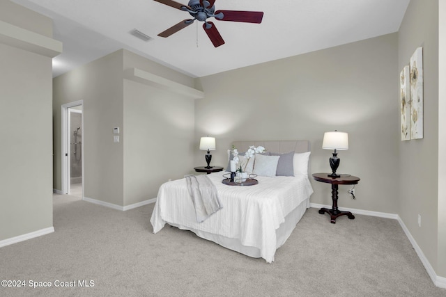 bedroom featuring ceiling fan and light carpet