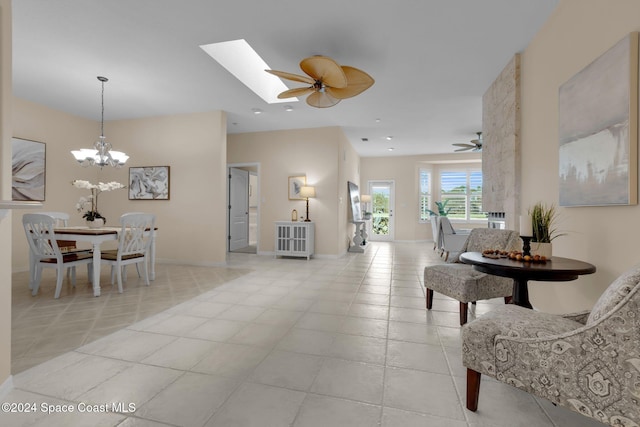 tiled living room featuring ceiling fan with notable chandelier