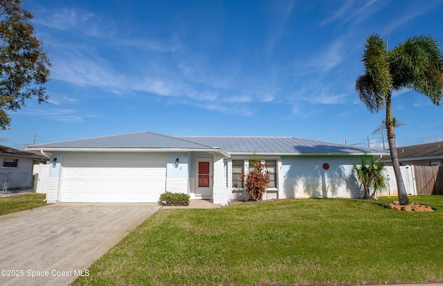 single story home featuring a garage and a front yard