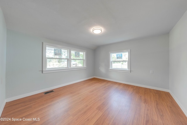 unfurnished room featuring light wood-type flooring