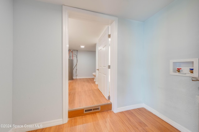 corridor featuring hardwood / wood-style floors