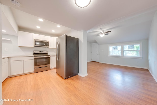 kitchen with white cabinets, appliances with stainless steel finishes, and light wood-type flooring